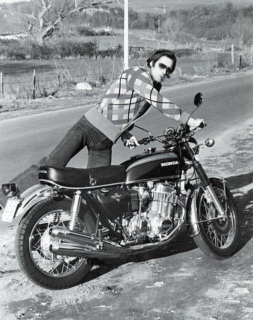 Italian actor and singer Fabio Testi getting on his 1970 Honda CB 750 Four Motorbike! Rome, 1974